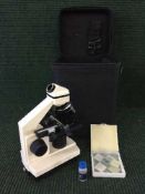 A Bresser Biolux AL microscope in carry case