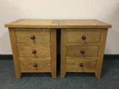 A pair of contemporary light oak bedside chests (2)