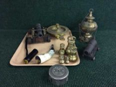 A tray of ornamental cannon, brass weights,