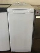 A Hotpoint slim line top loading washing machine