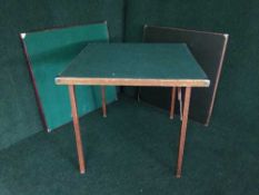 Three folding card tables