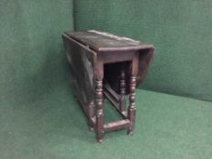 A late 19th century oak gate leg table