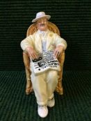 A Royal Doulton figure - Taking Things Easy HN2680