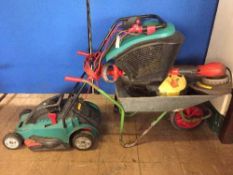 A Bosch lawn mower with box, wheel barrow,