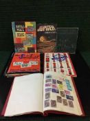 Six stamp albums containing stamps of the world