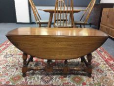 An Ercol elm drop leaf coffee table