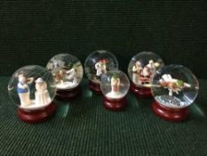 A tray of six Coalport characters - Snowmen Snowglobes