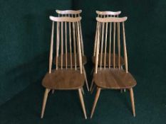 Four Ercol elm high backed dining chairs
