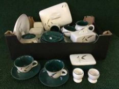 A box of Denby Green wheat oven proof dinner ware