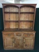 An antique pine kitchen dresser