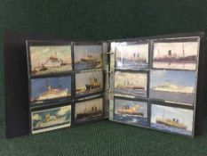A postcard album in slip case containing a quantity of antique postcards all relating to shipping
