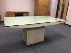 A marble dining table with plate glass top