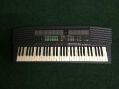 A Yamaha PSR 38 electric keyboard on stand - no lead