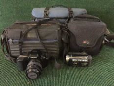 Box of three camera bags, JVC Evario hard disc camcorder, Minolta Dynax 5XI camera,