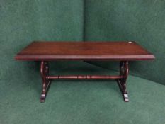 A mahogany refectory coffee table