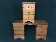 A pine knee hole dressing table and a bedside chest