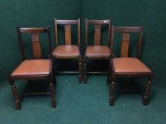 Four oak dining chairs