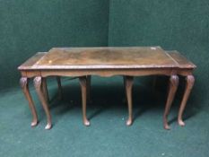 A walnut coffee table fitted two beneath