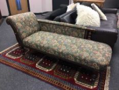 An Edwardian oak chaise longue,