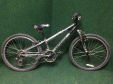 A boy's Specialized Hot Rock mountain bike