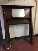A Victorian inlaid mahogany fire surround with mirror inset