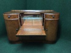 An early twentieth century walnut cocktail sideboard
