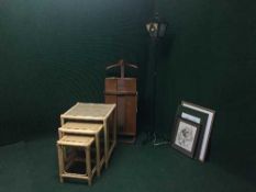 A nest of three bamboo and glass topped tables, metal street lamp standard lamp,