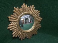 An early 20th century gilt sun burst mirror