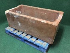 A large stone-glazed watering trough by J. Jameson & Son, Corbridge, approx 120 cm x 60 cm.