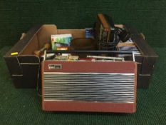 A box of CDs, Roberts radio, mobile phone, Sascellodi recorder,