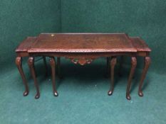 A nest of three mahogany coffee tables