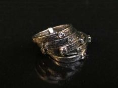 High carat white gold, tests 18, five-piece diamond ring with 9 stones approximately .6 carat, 8.