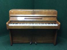 A walnut cased over strung mini piano by Zendeer
