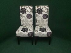 Two contemporary high back dining chairs