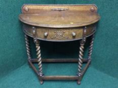 An Edwardian oak D-Shape hall table on barley twist legs,