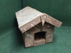 A wooden dog's kennel.