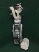 A golden bear golf set including bag, irons and drivers,