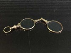 Pair of ornate Lorgnettes in gold frames and mounts