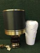 A china blue and white table lamp with shade together with three other lamps, white ceramic vase.