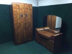 A three piece walnut bedroom suite