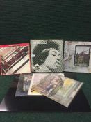 A collection of LP's and singles to include; Jimi Hendrix Anniversary Box Set, Jethro Tull,