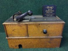A Roneo number 5 addressing machine in oak case