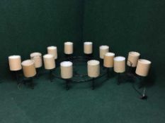 A large metal eight way light fitting,