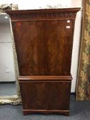 A reproduction mahogany cocktail cabinet,