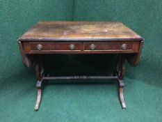 An inlaid mahogany sofa table fitted with two drawers