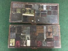 Two printer's trays containing blocks