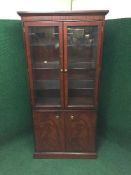A Stag Minstrel glazed door bookcase