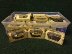 A box of die-cast vehicles, Matchbox Models of Yesteryear delivery vans,