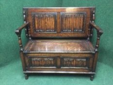 An Edwardian oak monks bench,