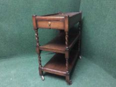 An oak barley twist trolley